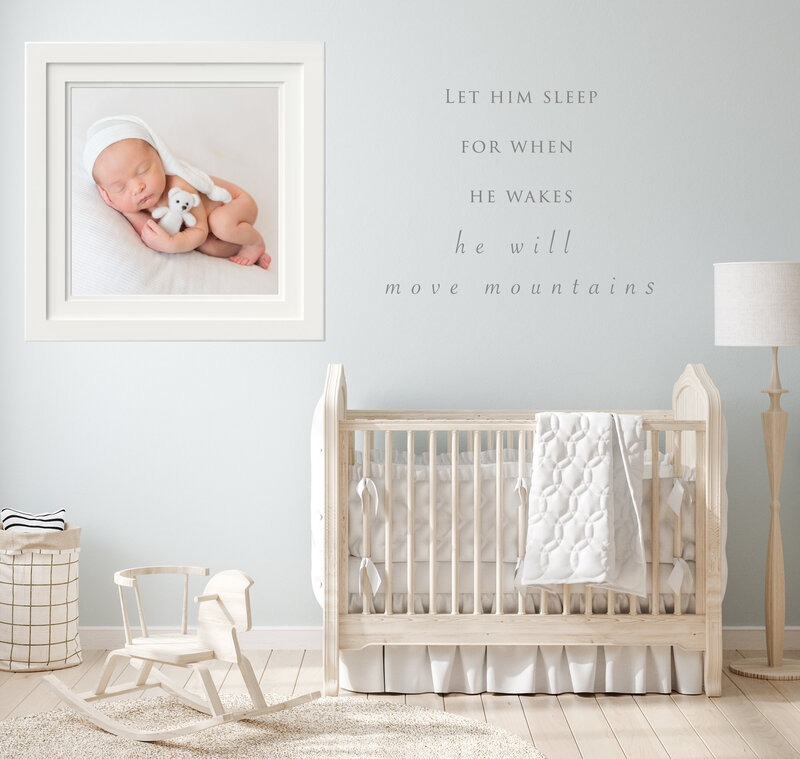 framed print hung in nursery