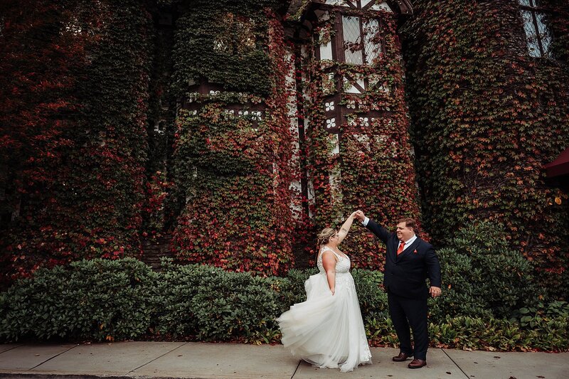 Bride and Groom in front of Ivy wall at The Peak