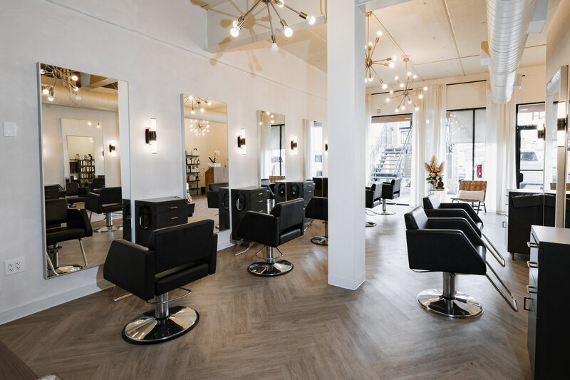 upscale hair salon with black white and gold decor