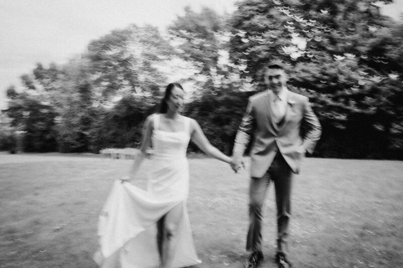 blurry black and white image of bride and groom