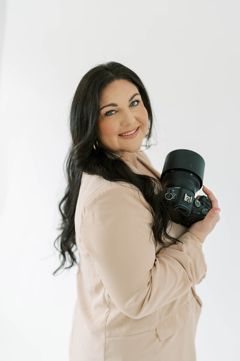 Anna holding a camera