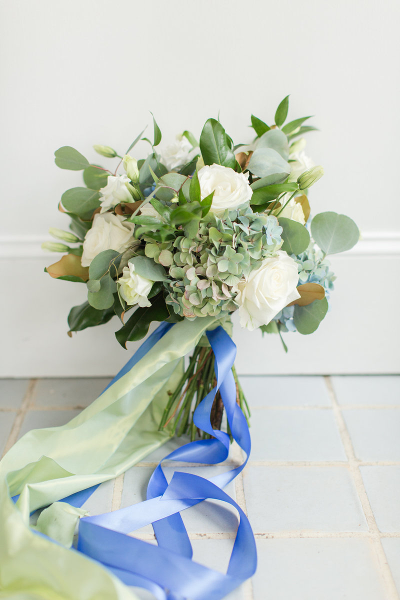 white rose and blue hydrangea wedding bouquet
