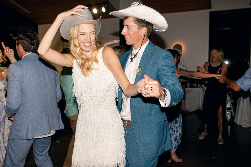 Bride and groom walk down the aisle at the emerson in texas