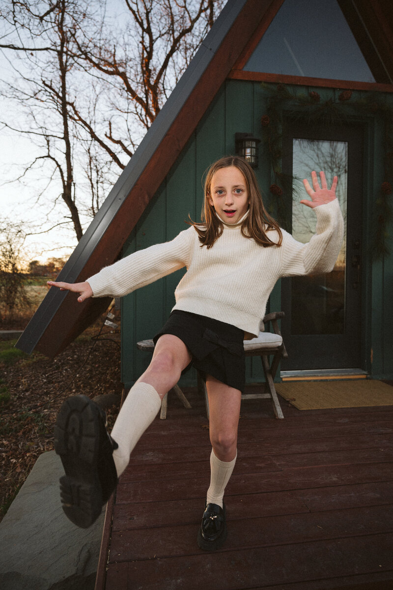 Candid lifestyle portrait of a child during a family photography session at a cabin in New York