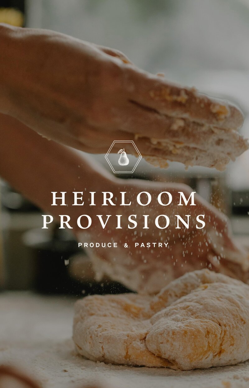 A closeup photo of a bread being made with a Heirloom Provisions logo on top