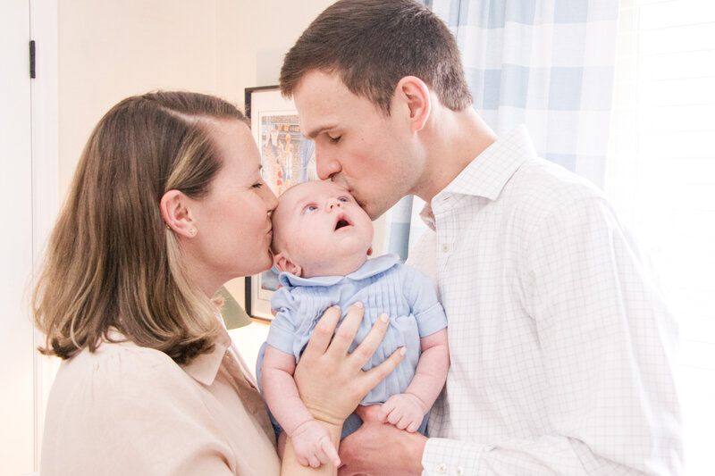 parents-kissing-baby-charlotte-nc