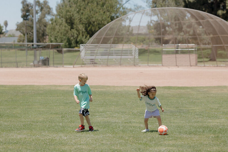 Kids playing soccer during a Pley Sports program in San Marcos, CA.