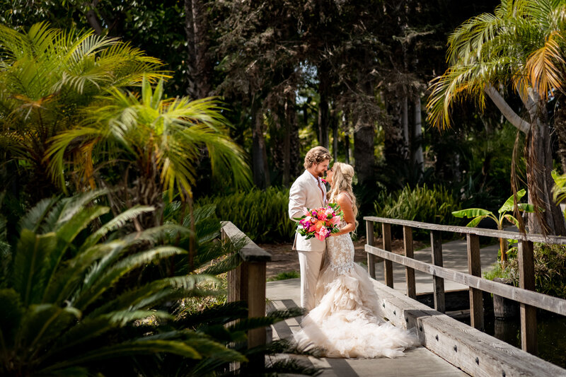 Texas Couple in coastal attire have a portrait session in Hawaii between jungle and palm trees photo by Tanya Parada