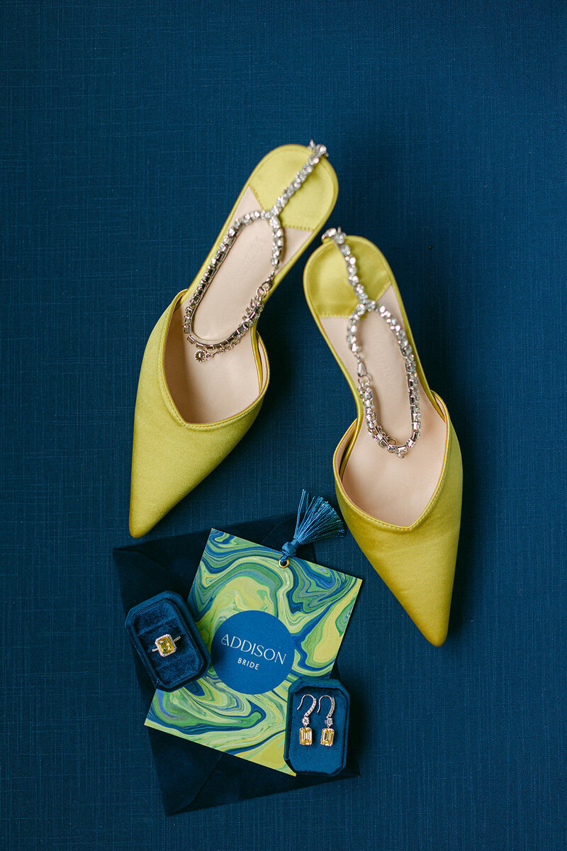 Soft blue linen flat lay mat styled with romantic paper goods and silk ribbon