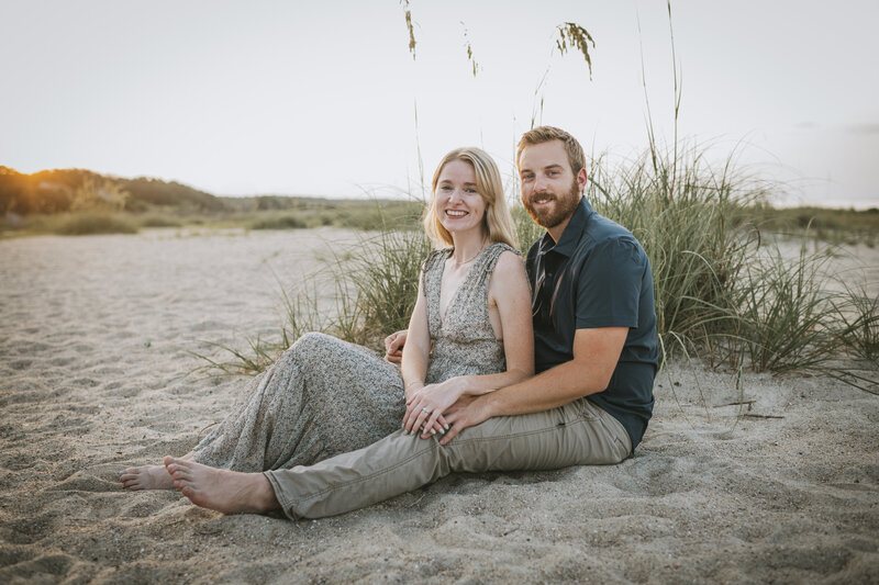 couple sitting on the beach at hilton head for engagement session