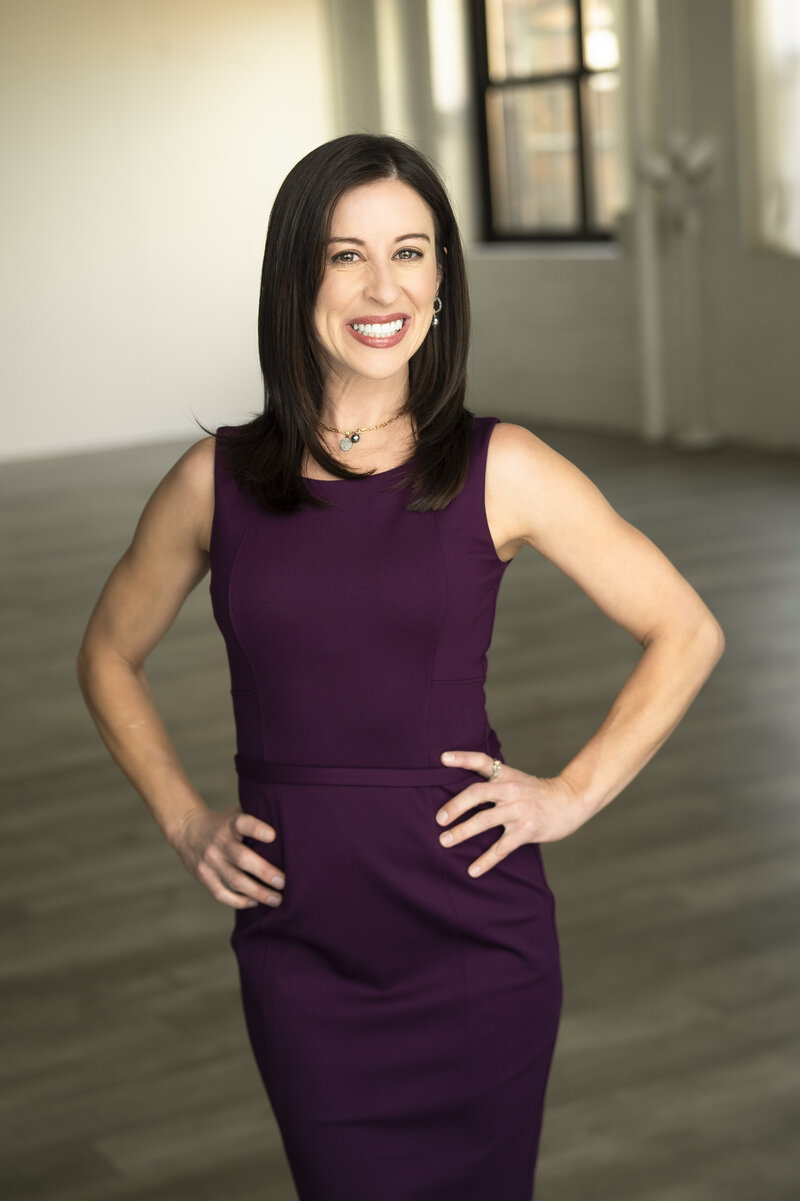 Dana standing w arms on hips