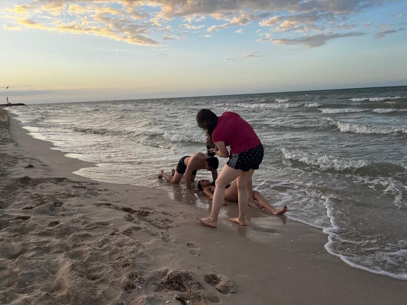 Natalia Baqueiro Behind the camera taking a couple's photo at the beach