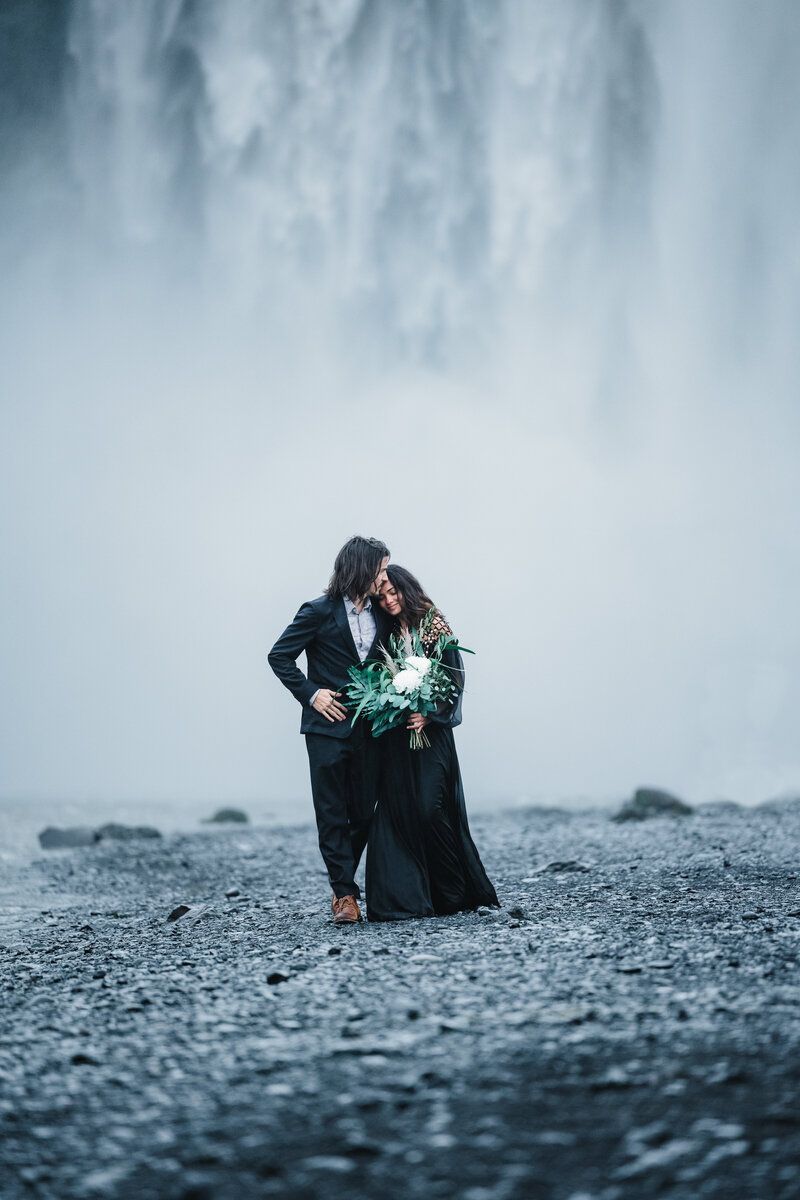 A groom dips his bride on a clifftop in Wisconsin