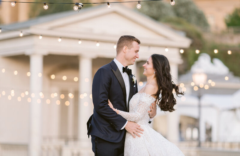 Couple smiling during their evening portraits at the Art Museum