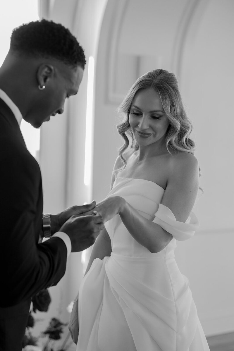 "Bride and groom celebrate their elegant luxury wedding at the historic Cottonwood Hotel in Omaha, NE – timeless moments captured by Tori Nichole Photography. A perfect blend of sophistication, romance, and architectural charm, showcasing the couple's love story in an unforgettable setting.