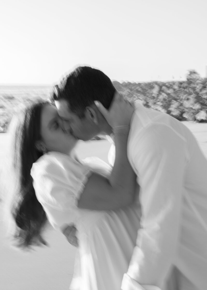 black and white mood couple photo at the beach