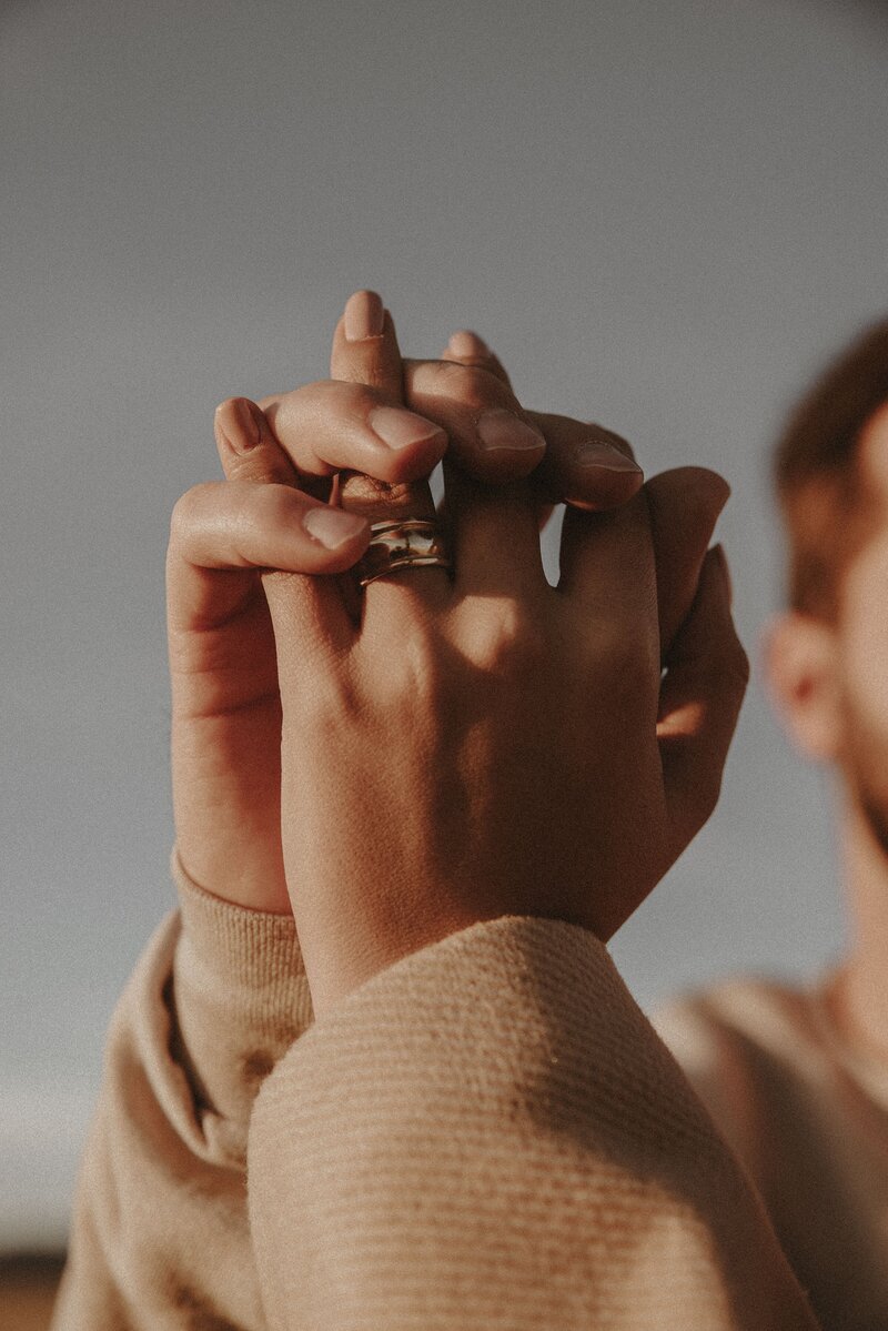 Holding hands, Gold ring, blue skies, outdoors