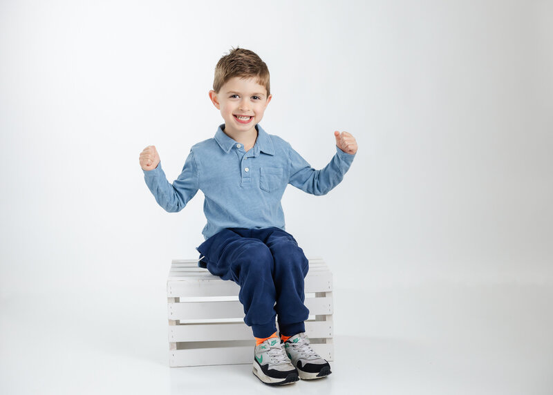 Light and airy personality portrait of a boy at Allison Reilly's Union County, NJ photo studio.