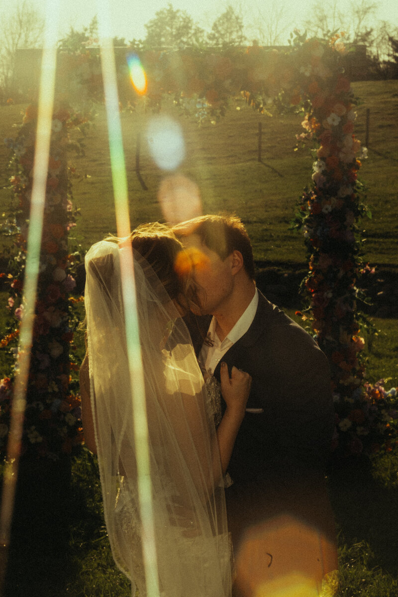 A couple kiss with a POWERFUL sunbeam.