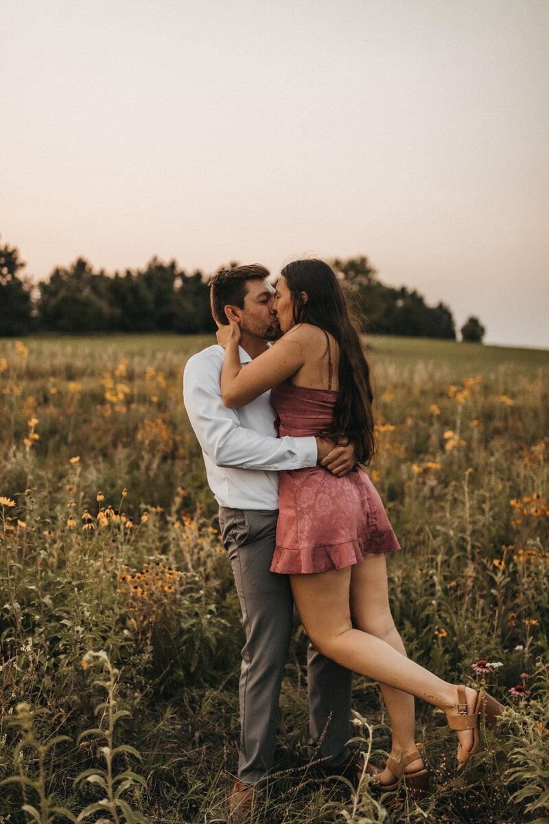 Engagement Session kissing casual hat