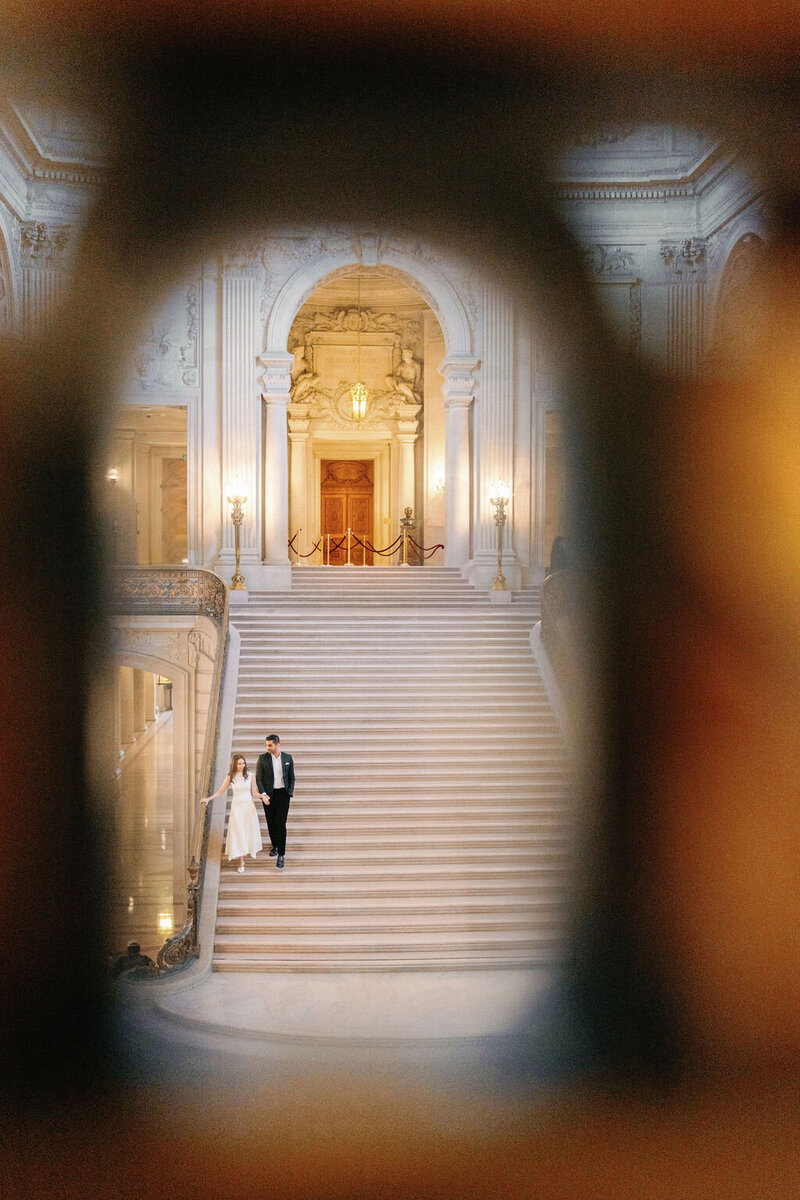Bride holding groom's hand and floral bouquet by photographer chicago Allison Francois