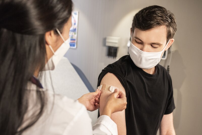 Photo of man getting vaccinated