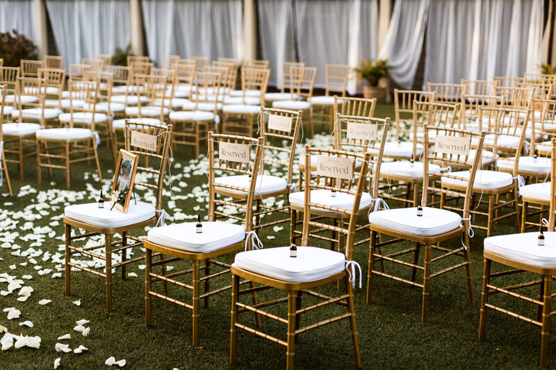 outdoor wedding ceremony setup chiavari chairs gold petal aisle