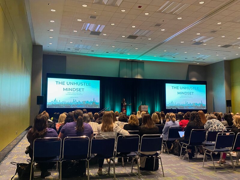 Milena speaking at conference