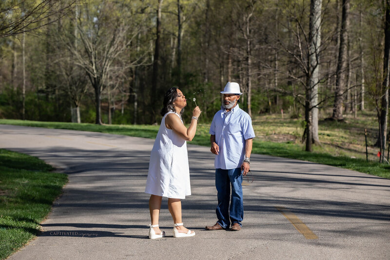 Couple-engagement-session-standing-in-street-posing