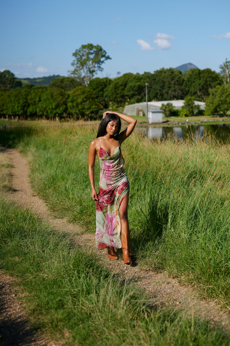 Female in floral dress on farm
