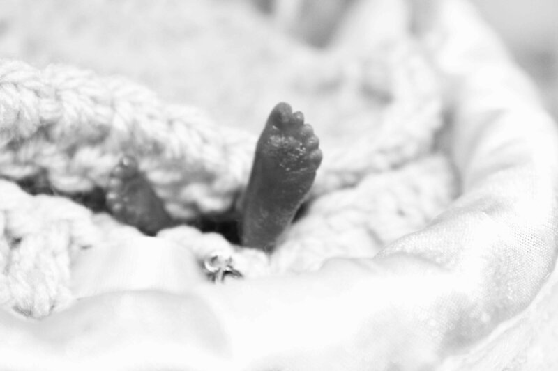 precious feet of stillborn baby in crochet bereavement cradle.jpg