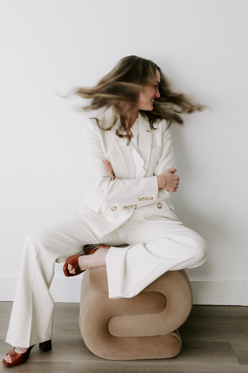 Website copywriter Erika Fitzgerald in a white suit