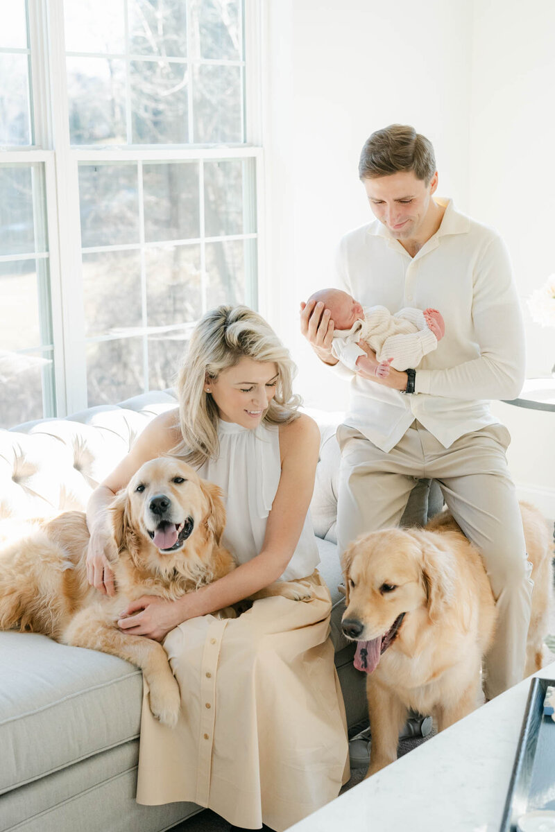 mom holds smiling sleeping bay during her philly newborn session
