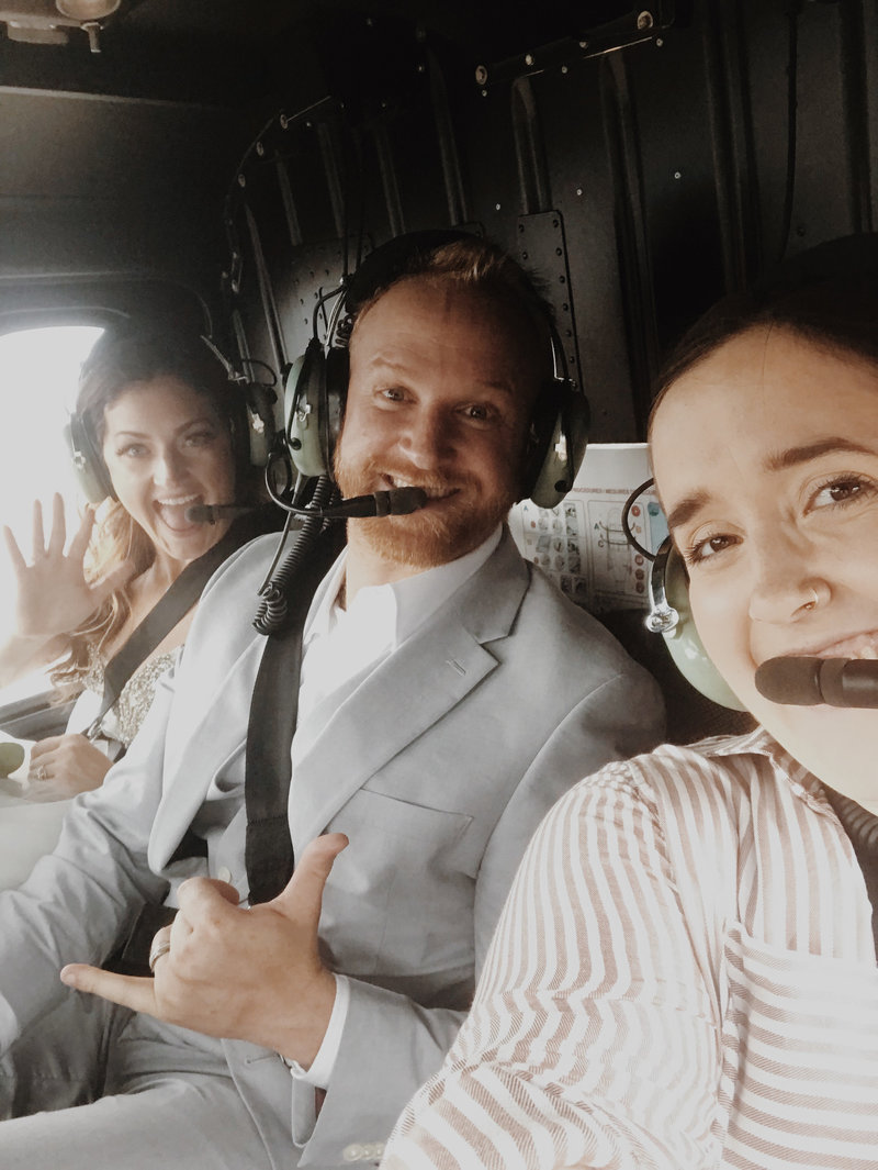 lauren roberts with bride and groom in helicopter elopement
