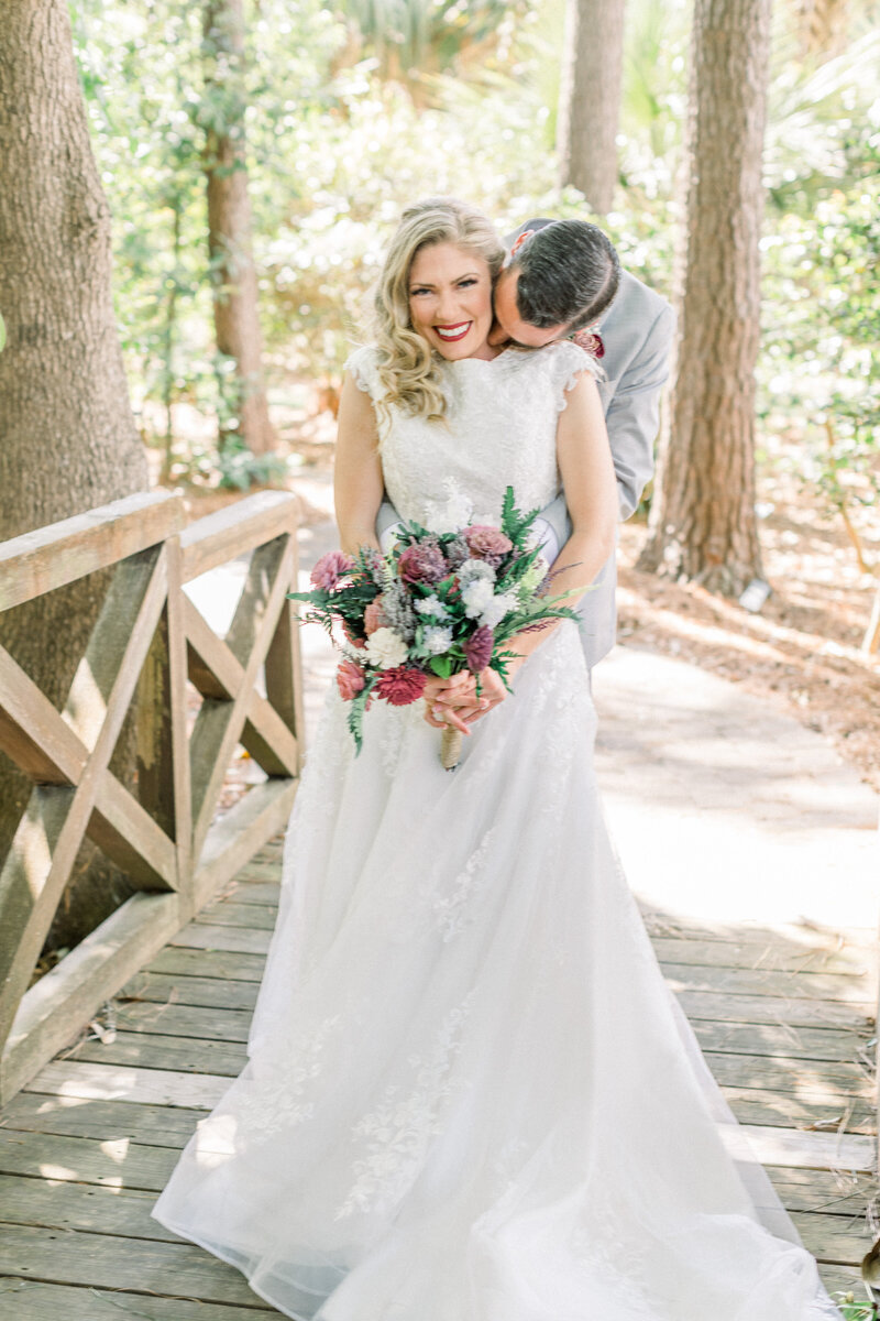 photo of bride and groom on a bridge