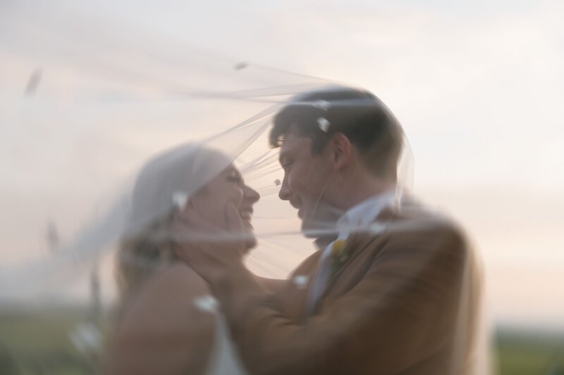 bride and groom under the veil