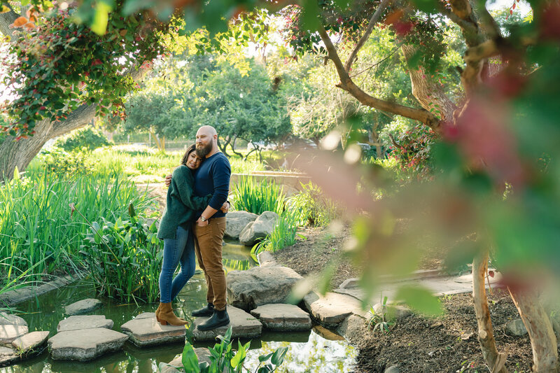couple embraces for santa barbara engagement photographer