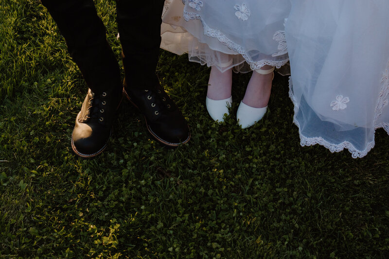 Golden hour wedding portraits in Ottawa, where the bride and groom share a quiet moment, bathed in warm, dreamy light