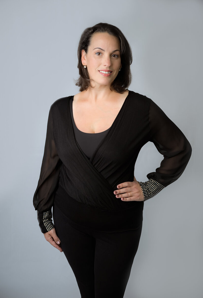 Head shot by E. Benecki Photography of a photographer on a light gray background