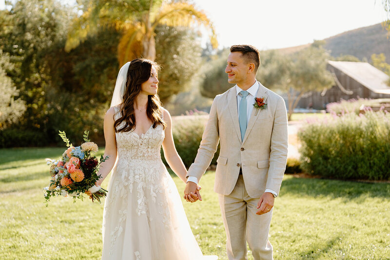 couple walking on a dirt path
