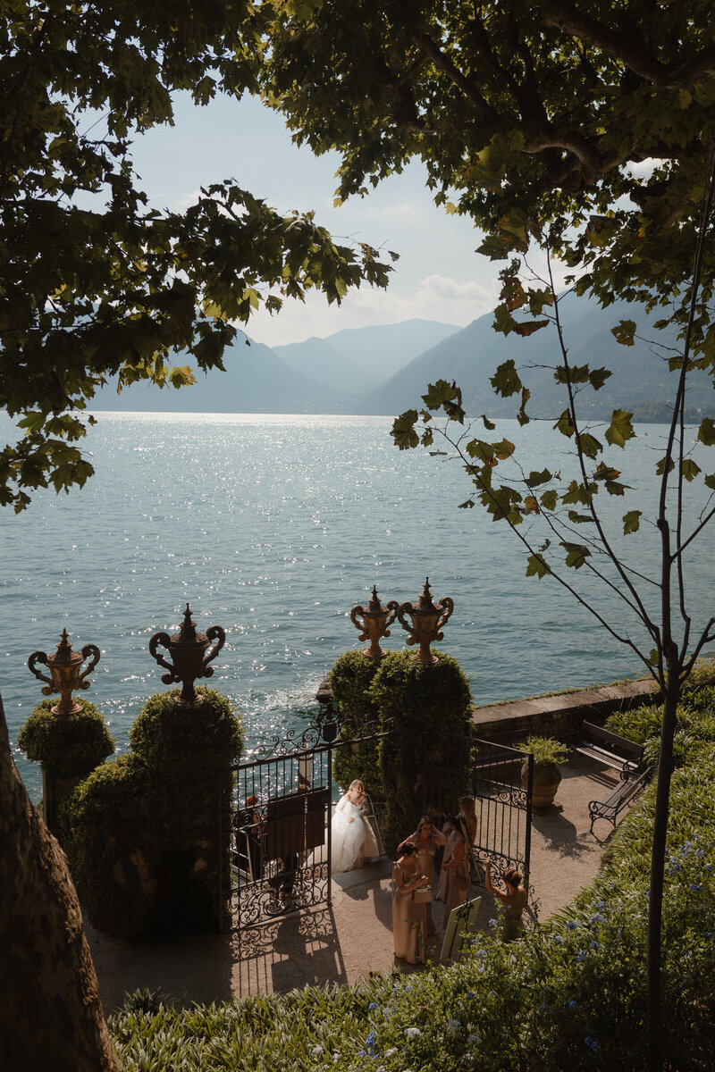 Bride and groom share an intimate moment hand in hand at their countryside manor wedding