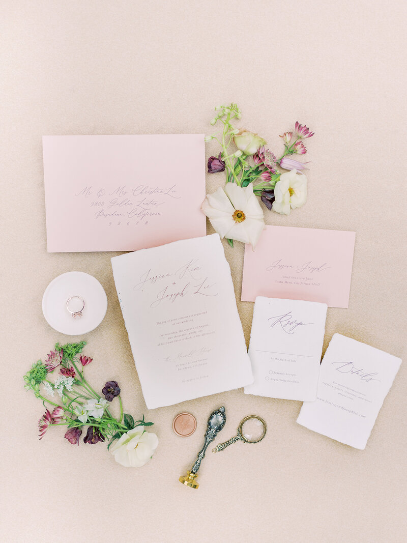 15-alisonbrynn-Radiant-LoveEvents-Maxwell-1-House-flatllay-wedding-invitation-floral-details-tan-backdrop-romantic-elegant-timeless