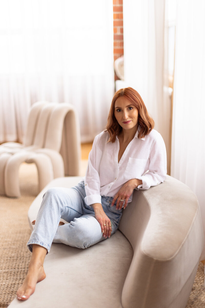 Portrait of Leigh Anne Kuzma, founder of Rove Skin and Wellness in Markham, smiling in a calming treatment room.