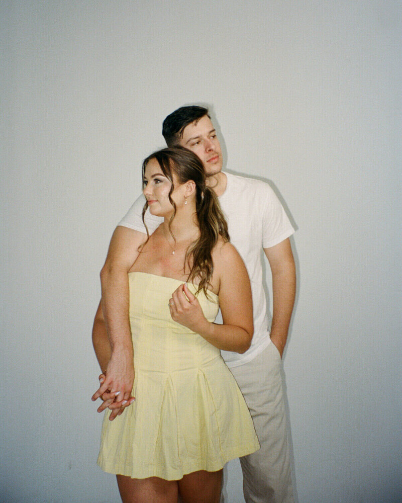 husband and wife fort myers florida photographers posing in studio