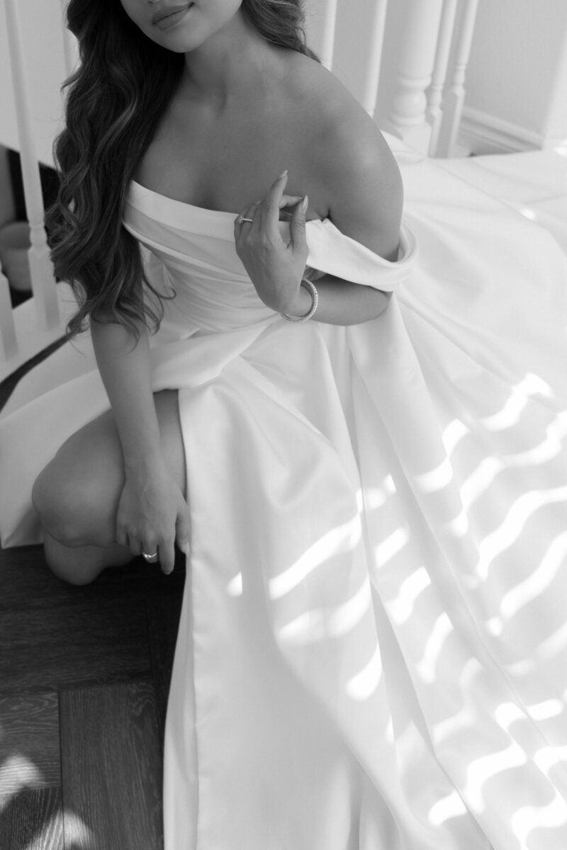 black and white photo of bride in elegant dress