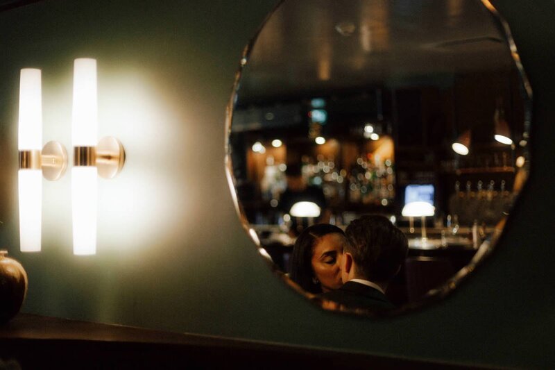 wedding couple kissing inside the romantic kissa tanto restaurant in vancouver