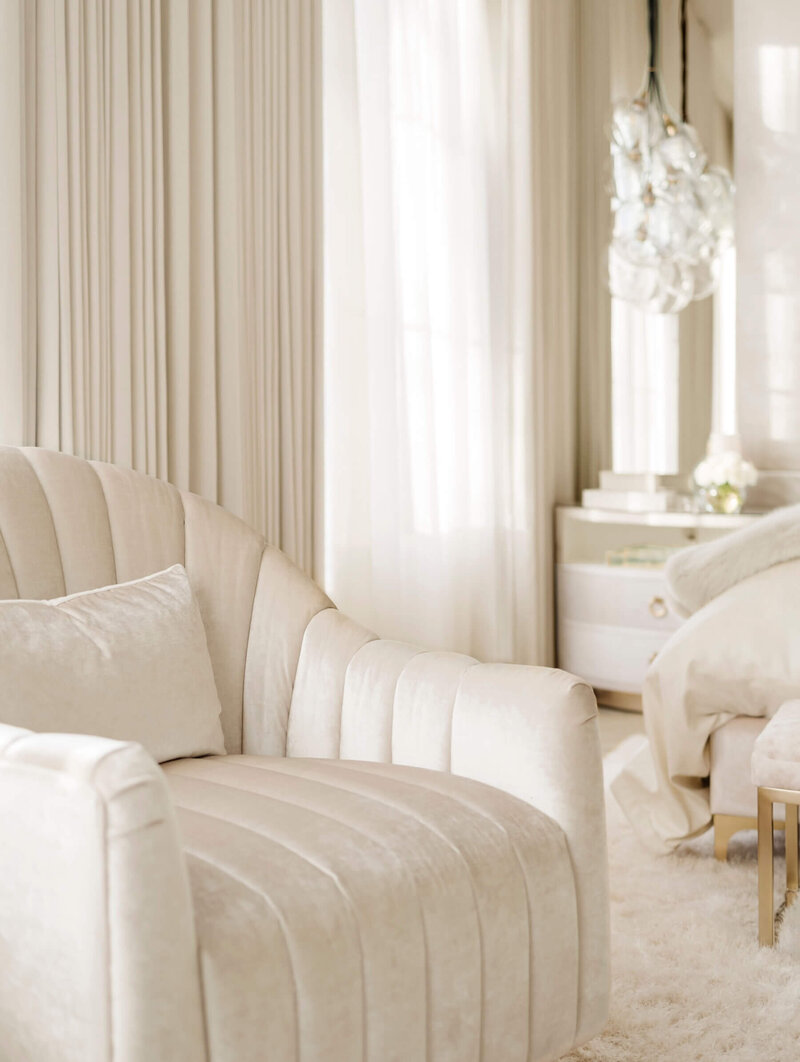 A custom channel swivel chair in soft light velvet tones. 