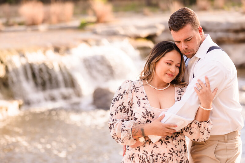 Couple enjoy the sun during their engagement session at Bull Creek in Austin, Texas. Photo taken by Austin Engagement Photographers, Joanna & Brett Photography
