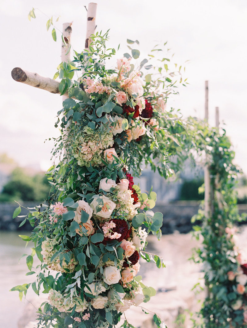 pink-peach-roses-birch-wedding-ceremony-arch-Stephanie-Brauer