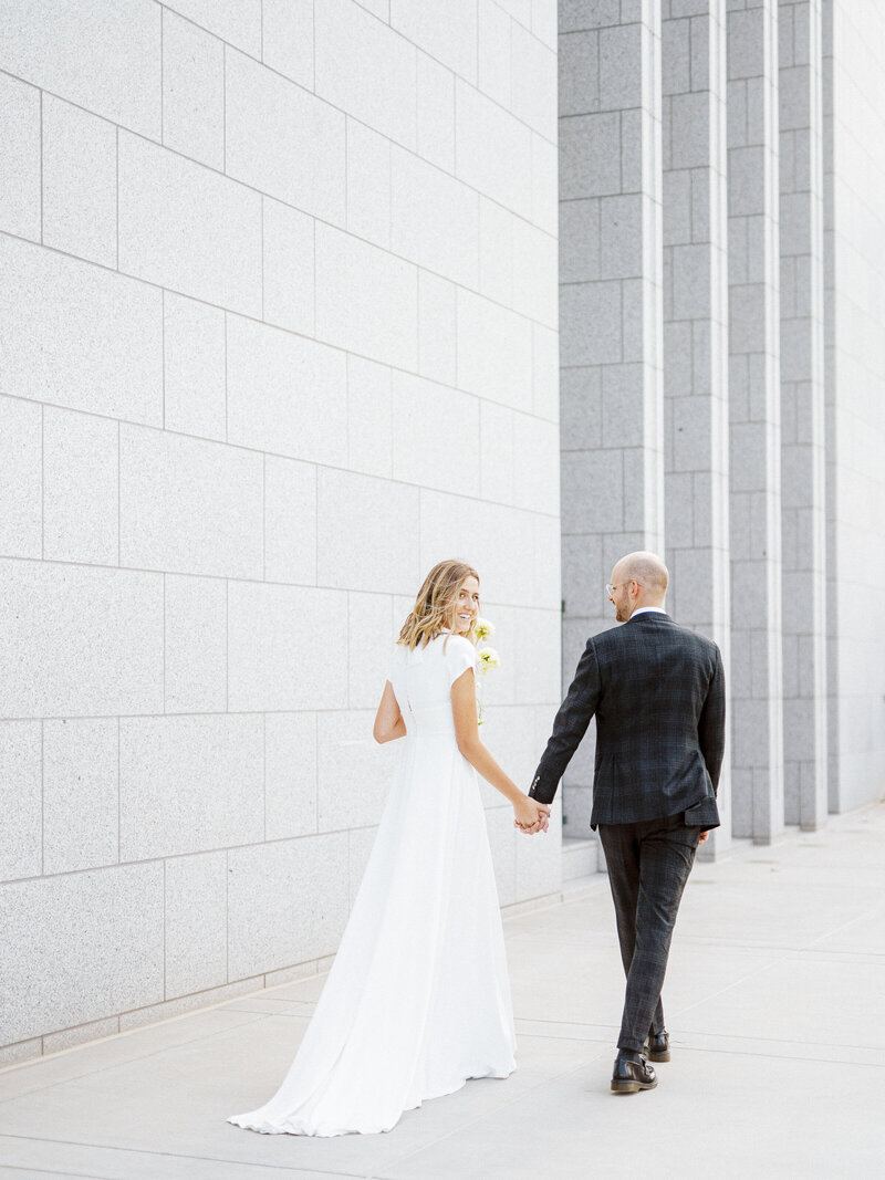 Bride and Groom walking at Temple